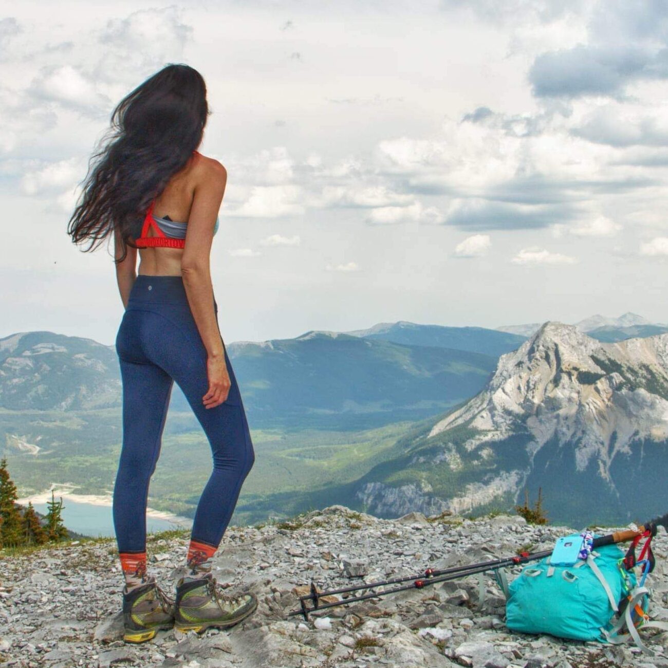 Layla Messner, the Instinctual Woman, on a mountain summit by Kelly's Perspective